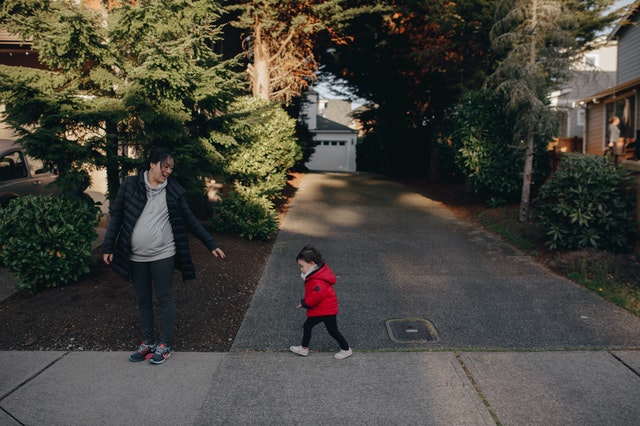 mother and child on sidewalk